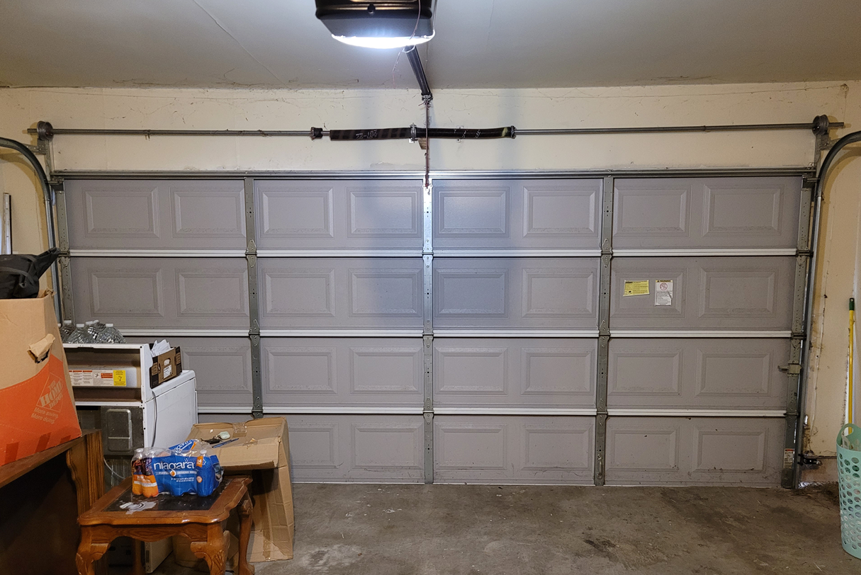 A garage door with a few doors

Description automatically generated with medium confidence